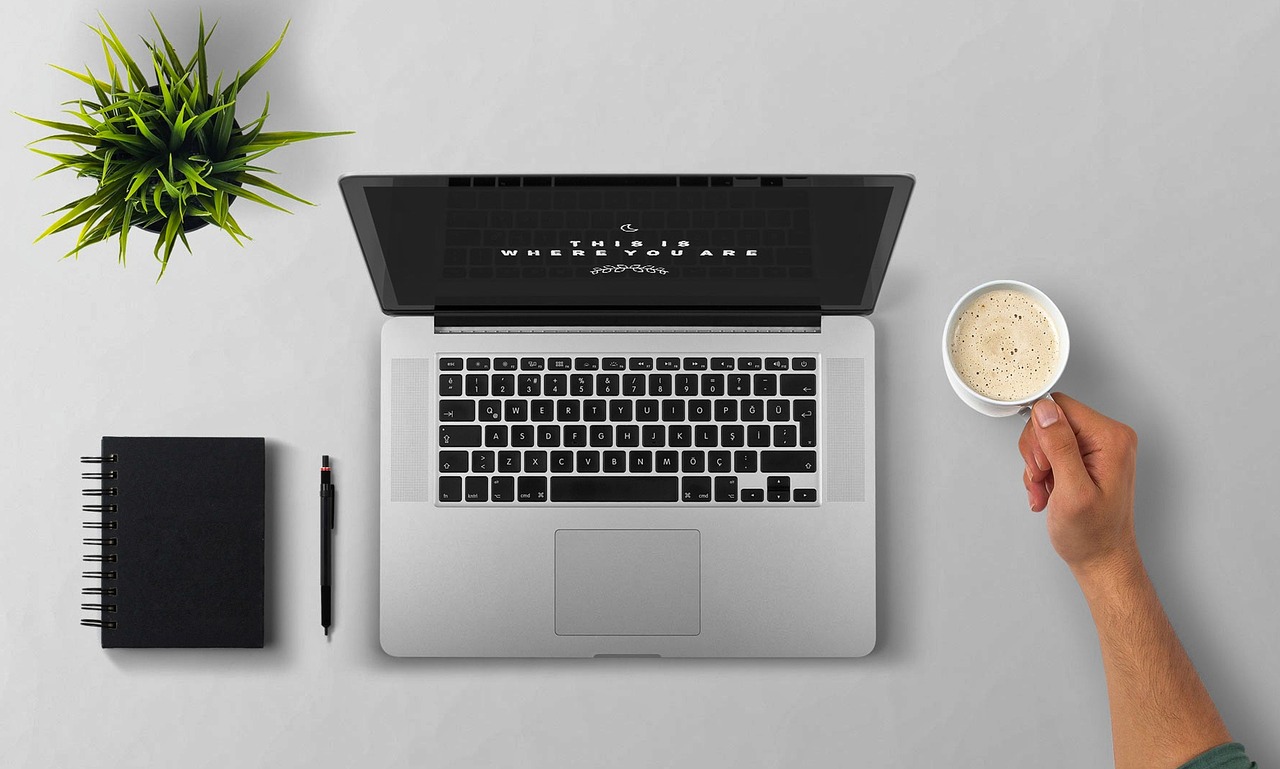 Laptop, coffee, arm — Increase Your Instagram Followers With Idigic